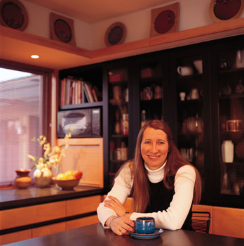 
Susanka incorporated a large picture window in her living room, which allows her to feel more connected with the woods surrounding her home and the wildlife that lives in them. Minnesota winters have never been a favorite of Susanka’s, but being able to participate with the external world while she’s in her home has made them easier. Relaxing in the home she designed for herself in St. Paul, Minnesota, has helped Susanka cope with the many demands of success. “It was incredible to move into that house—there was a sense of calm, of being pretty constantly delighted by the light, the composition,” she says.
